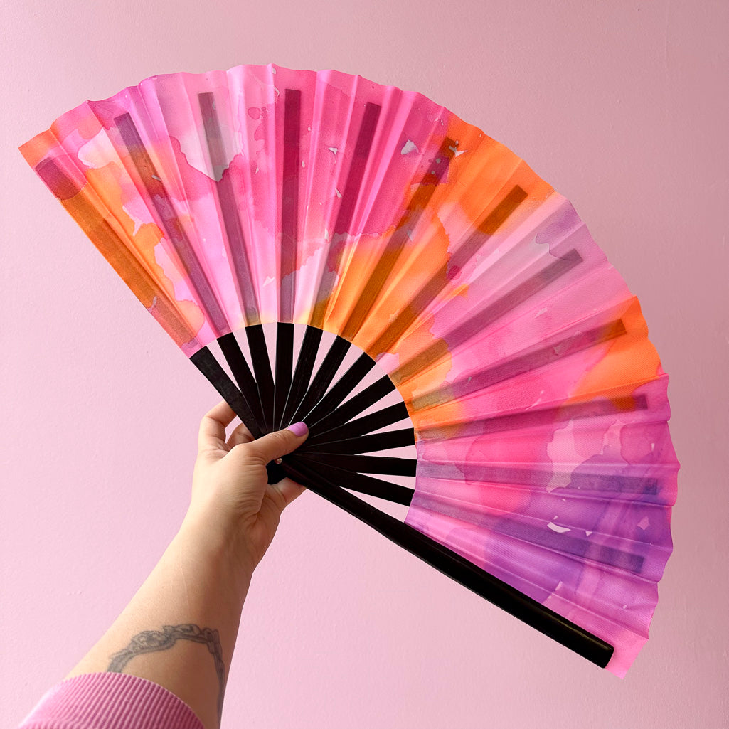 Giant Clacking Hand Fan with Pink, Orange & Lilac Abstract Watercolour print (Glows in UV!)